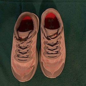 Red and grey under armor shoes